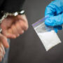 A police officer finds drugs during the search of drug dealers